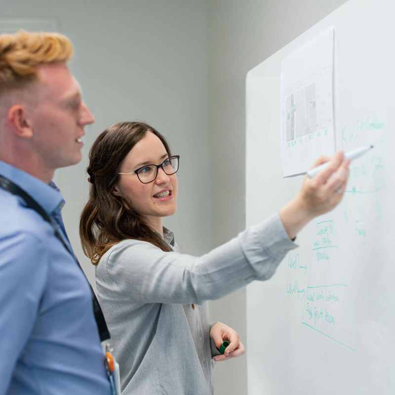 A mentor demonstrates a teaching exercise for a young male student for the award in education and training (AET)